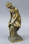 COINCHON Théodore A Gilt Bronze Figure Of A Bather, Wearing A Tiara And Necklace With One Leg Raised On A Tree Stump COINCHON Théodore A Gilt Bronze Figure Of A Bather, Wearing A Tiara And Necklace With One Leg Raised On A Tree Stump
