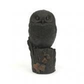 DULK Of An Owl Perched On A Tree Trunk DULK Of An Owl Perched On A Tree Trunk