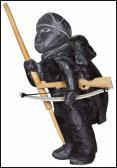 TALIRUNILI Joe Hunter Carrying A Seal With Harpoon, Bow And Rifle TALIRUNILI Joe Hunter Carrying A Seal With Harpoon, Bow And Rifle