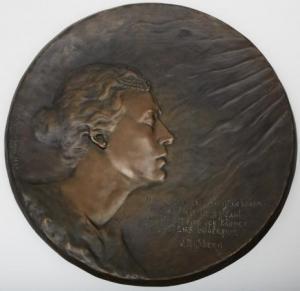 SPRINCHORN Gerda,Relief med motiv av kvinnoansikte samt vers av Vik,1897,Uppsala Auction 2015-01-20